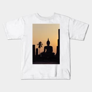 Buddha statue against sunset silhouette Kids T-Shirt